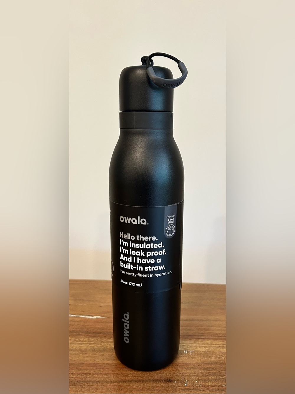 Owala Free Sip. 24 ounce Insulated Black Water Bottle with Built-In Straw.